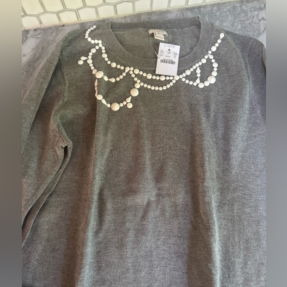 New with tags grey Jcrew sweater. Size Medium